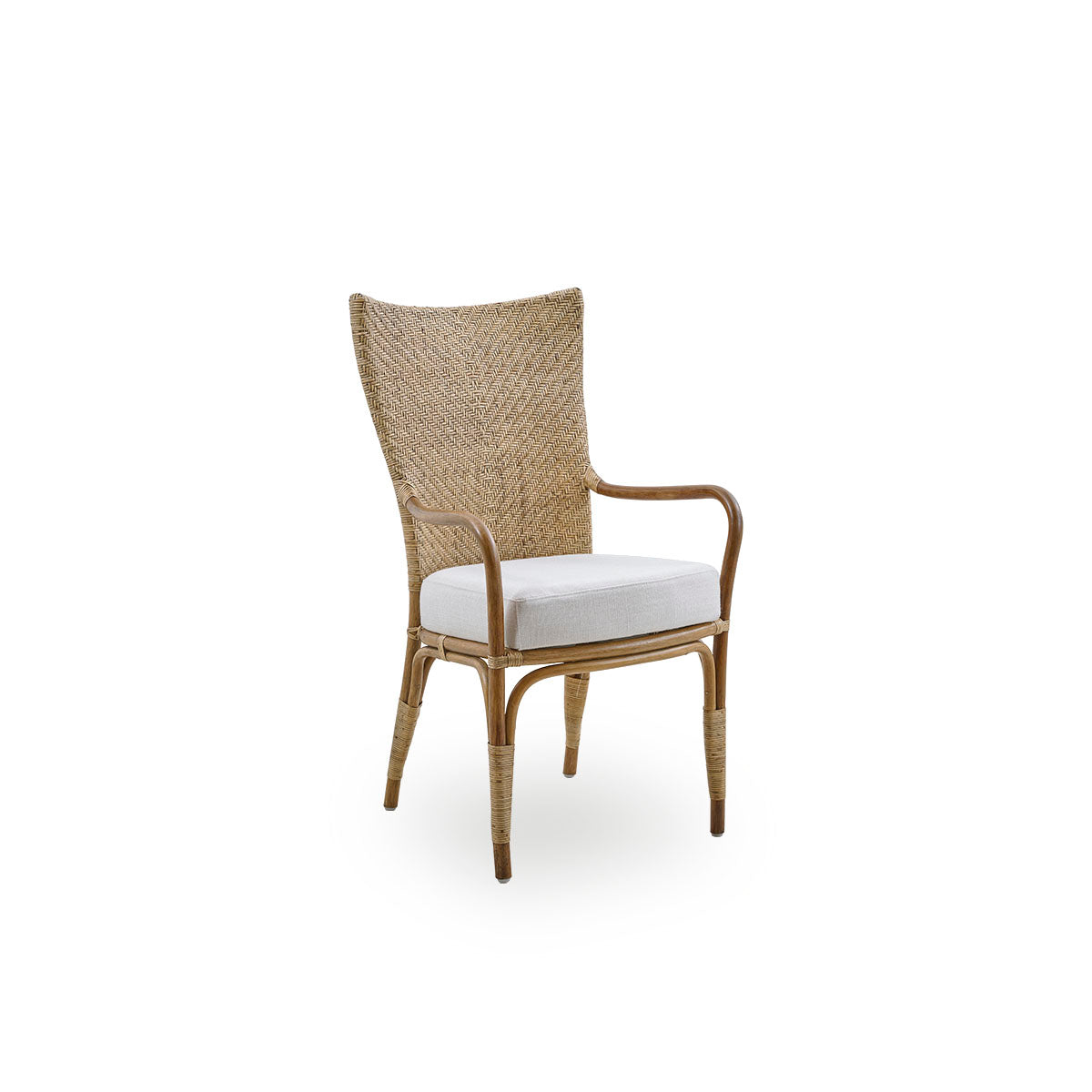 Side view of Melody dining armchair in Antique rattan color with high fully woven rattan backrest and upholstery seat.