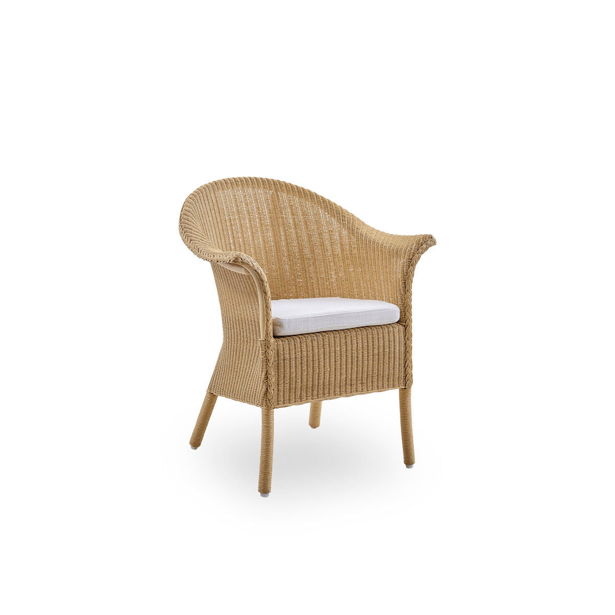 Side view of Classic dining chair, a fully woven wicker dining chair handcrafted in Lloyd Loom material. The Classic chair features armrests and a high backrest for extra comfort and support.