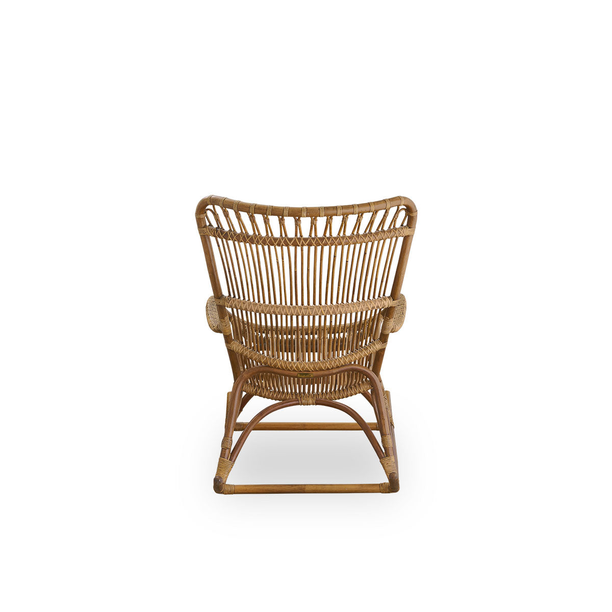 Plain back view of Monet rocking chair with high backrest and armrests presented in Antique brown color. Handcrafted from high-quality Indonesian rattan.