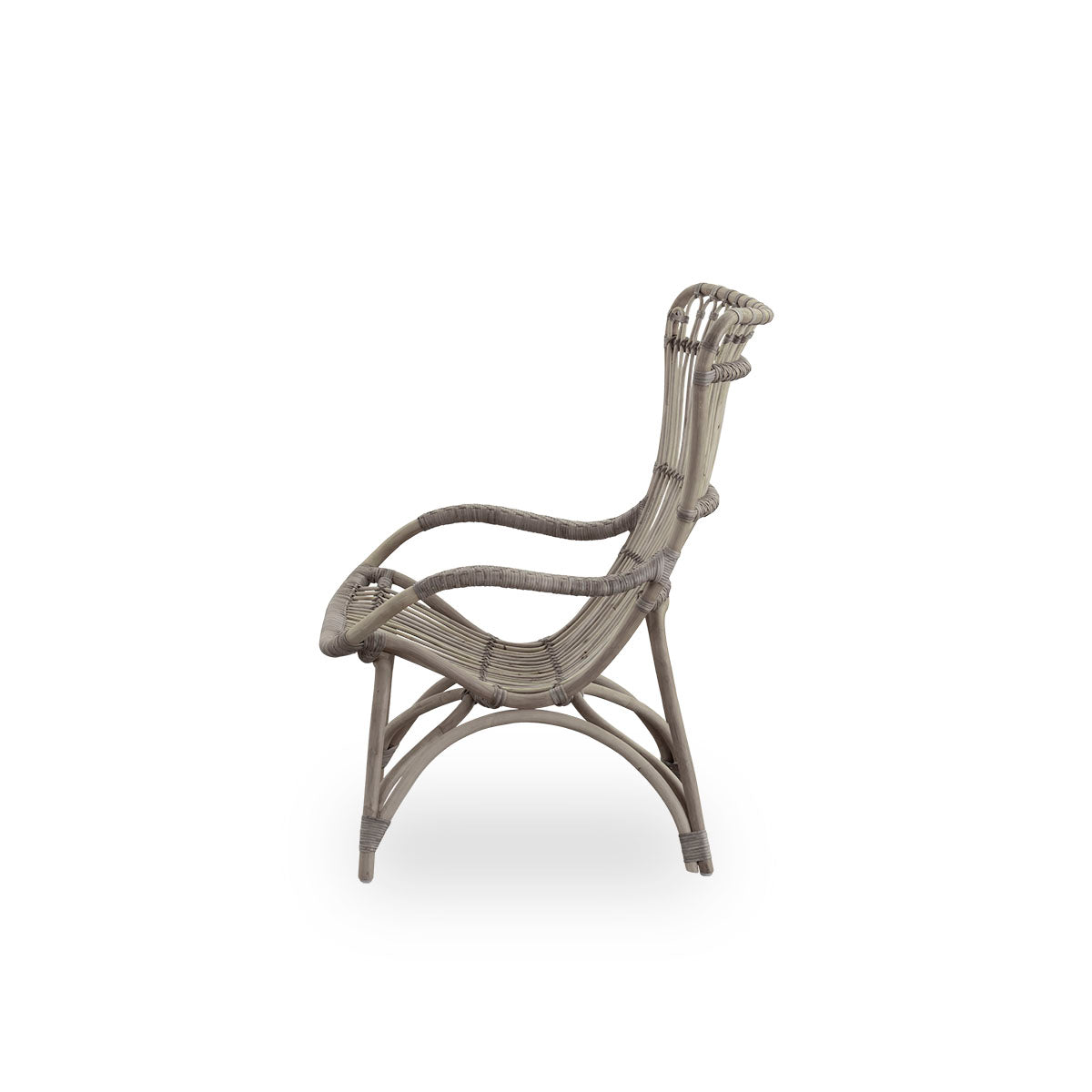 Plain side view of Monet lounge chair with high backrest and armrests presented in Taupe color. Handcrafted from high-quality Indonesian rattan.