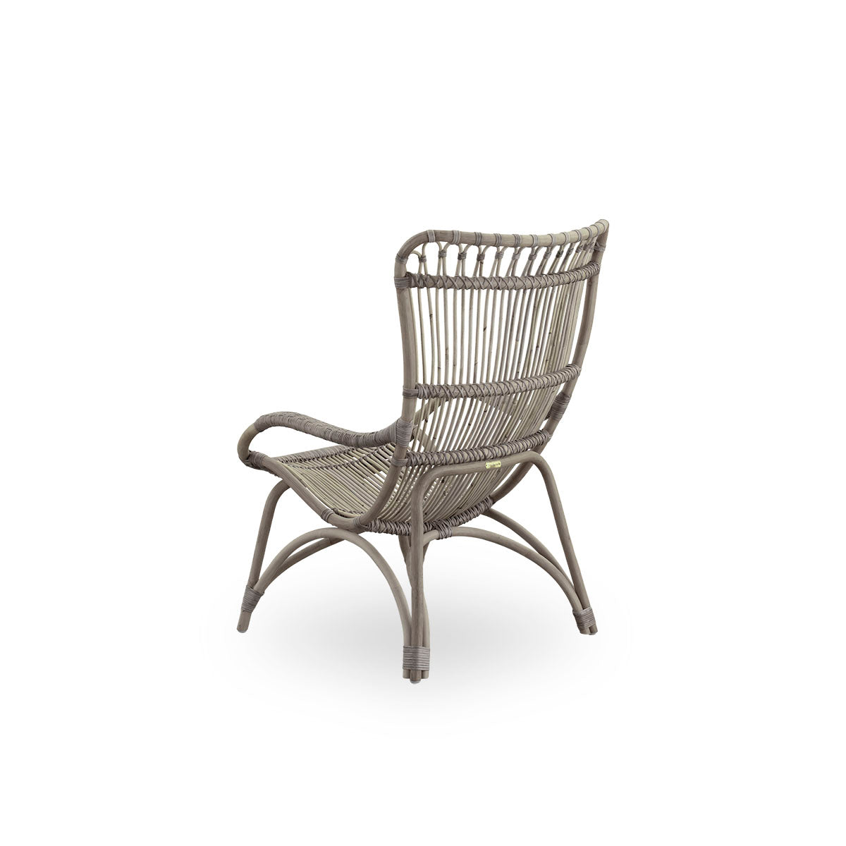 Plain back view of Monet lounge chair with high backrest and armrests presented in Taupe color. Handcrafted from high-quality Indonesian rattan.