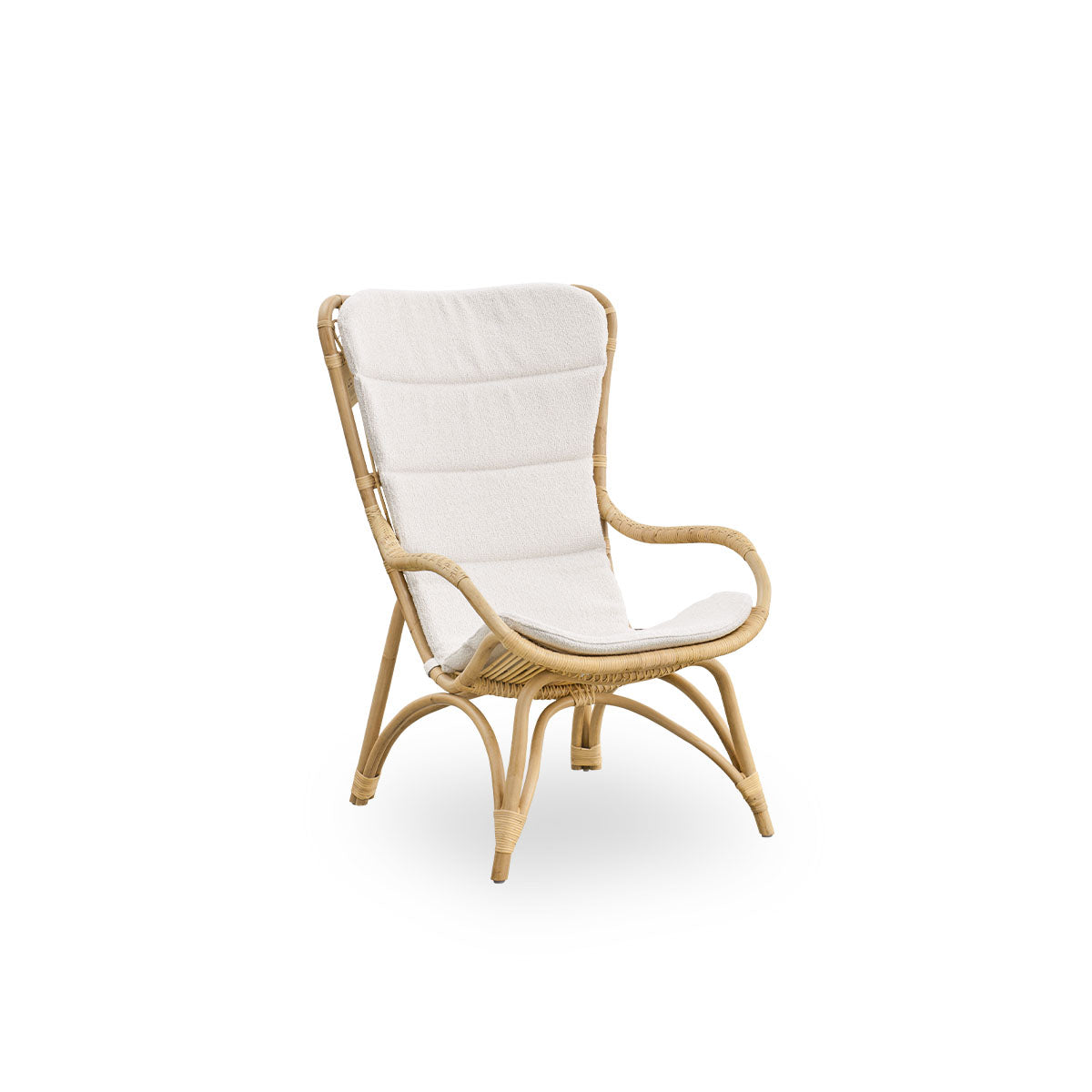 Side view of Monet lounge chair with high backrest and armrests presented in natural rattan. Handcrafted from high-quality Indonesian rattan.