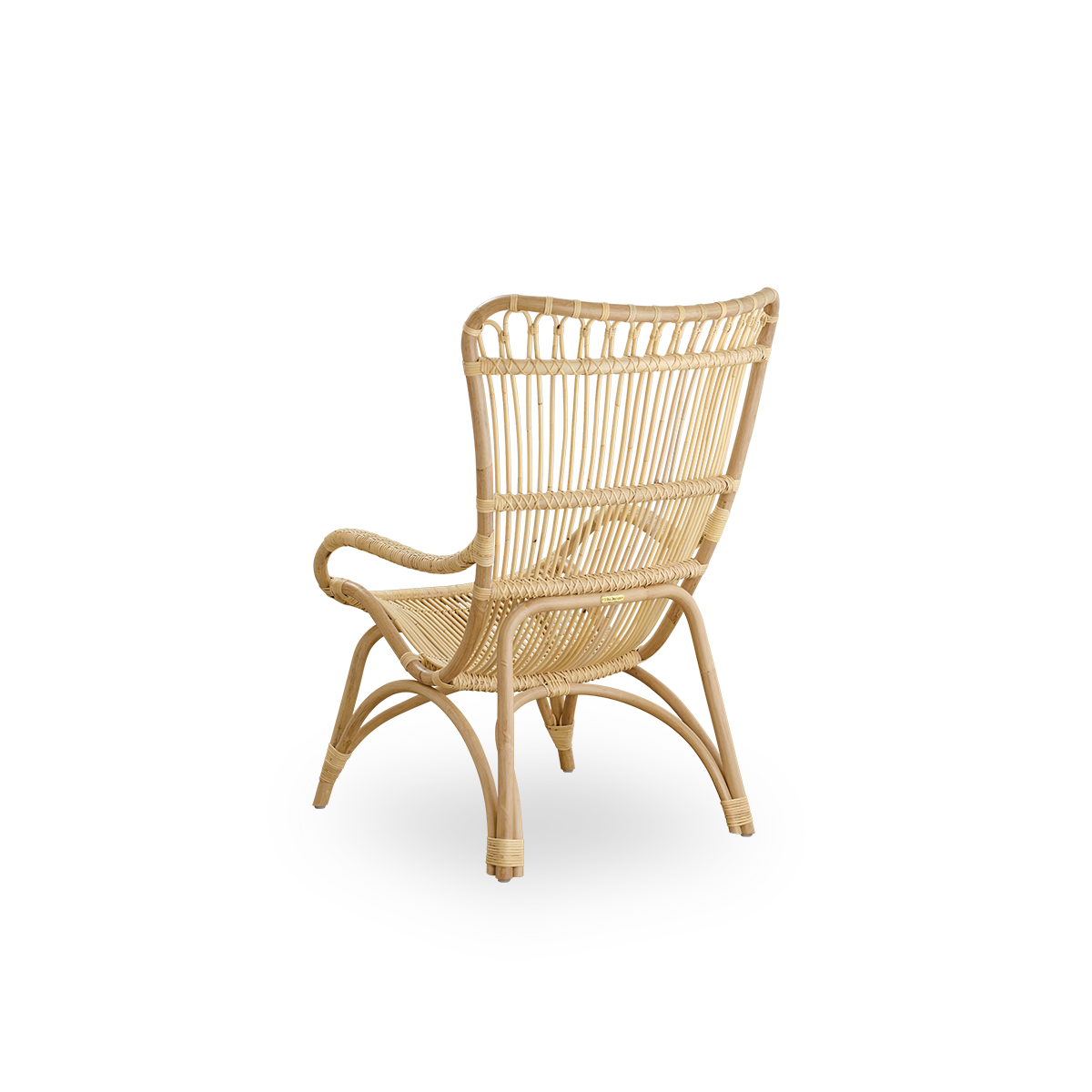 Back side view of the Monet lounge chair with high backrest and armrests presented in natural rattan.
Handcrafted from high-quality Indonesian rattan.