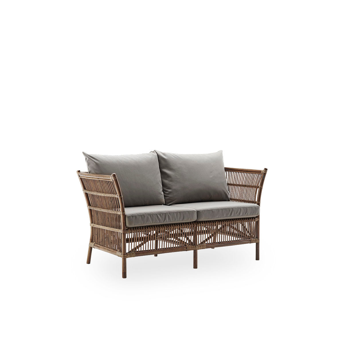 Side view of Donatello 2-seater wicker sofa in Antique brown color. The sofa has a boxy design with strict lines handcrafted from high-quality Indonesian rattan.