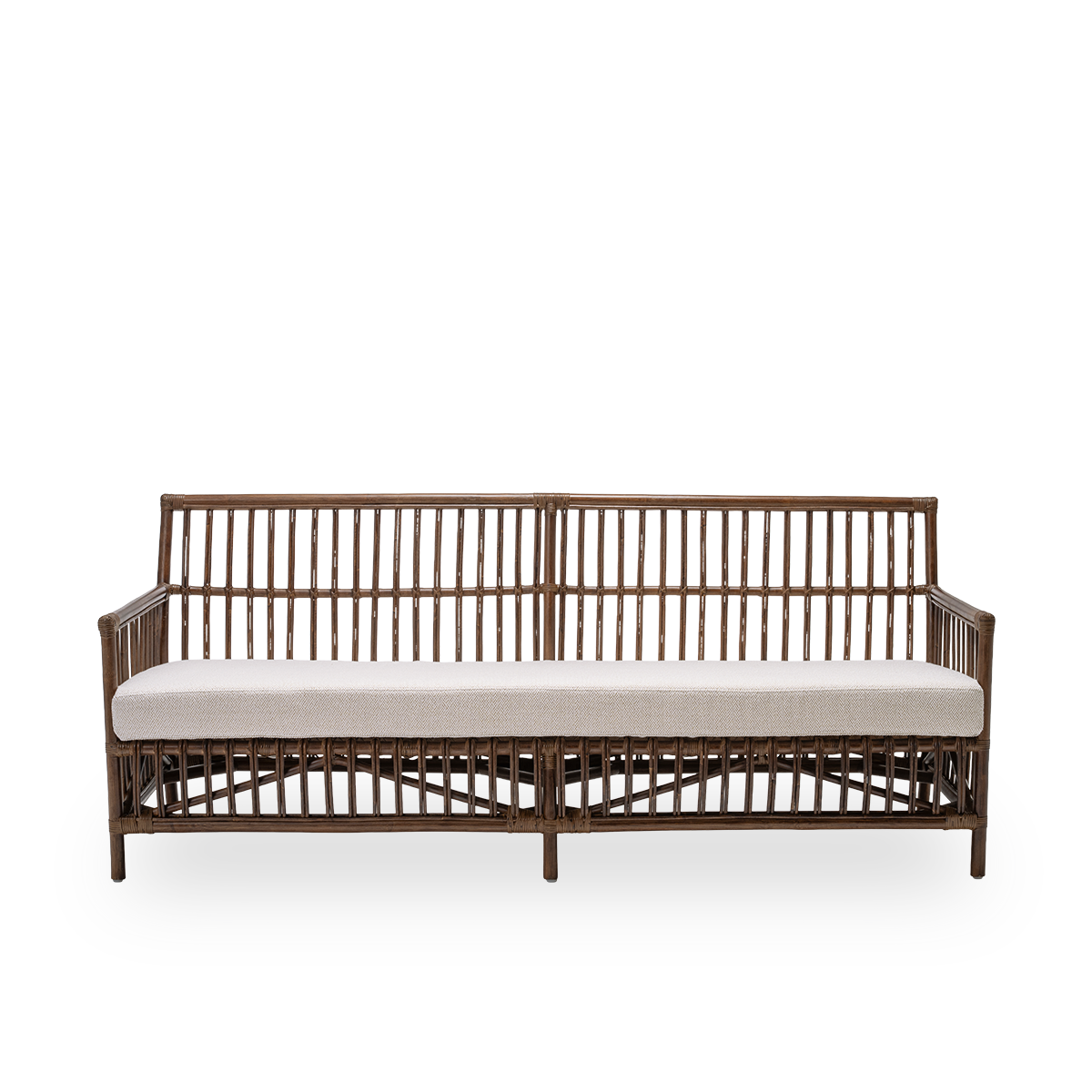 Front view of the Caroline sofa with seat cushion, in brown rattan. A simple and elegant Danish design whose detailed windings make it a quiet element in the room. Handcrafted from high-quality Indonesian rattan.