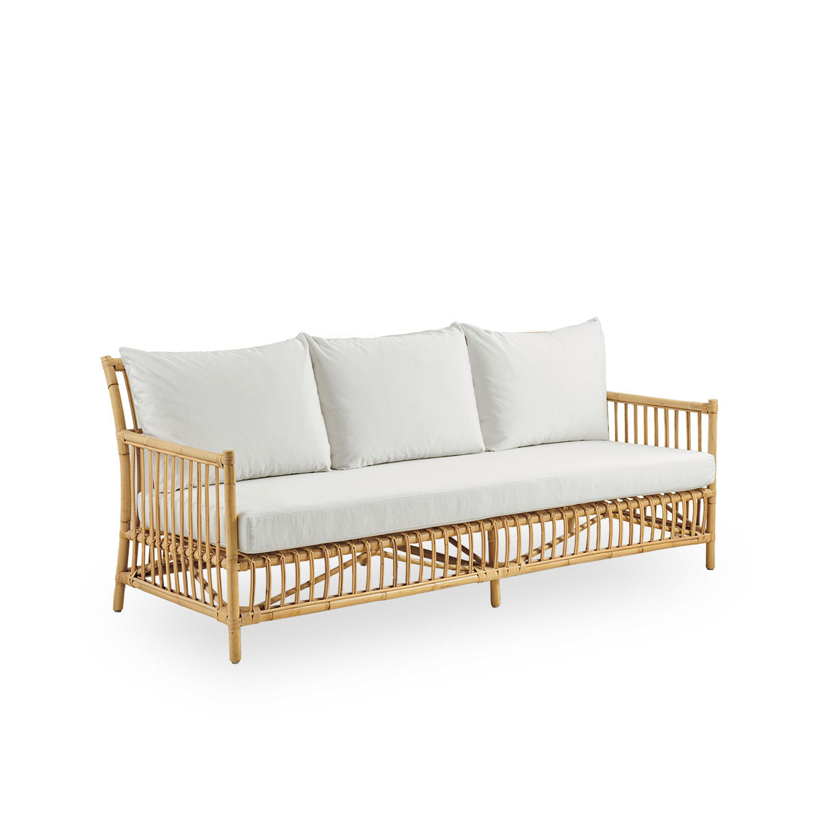 Side view of Caroline 3-seater wicker sofa, simple and elegant Danish design. Handcrafted from Indonesian rattan with detailed woven accents for a cozy, calming presence.