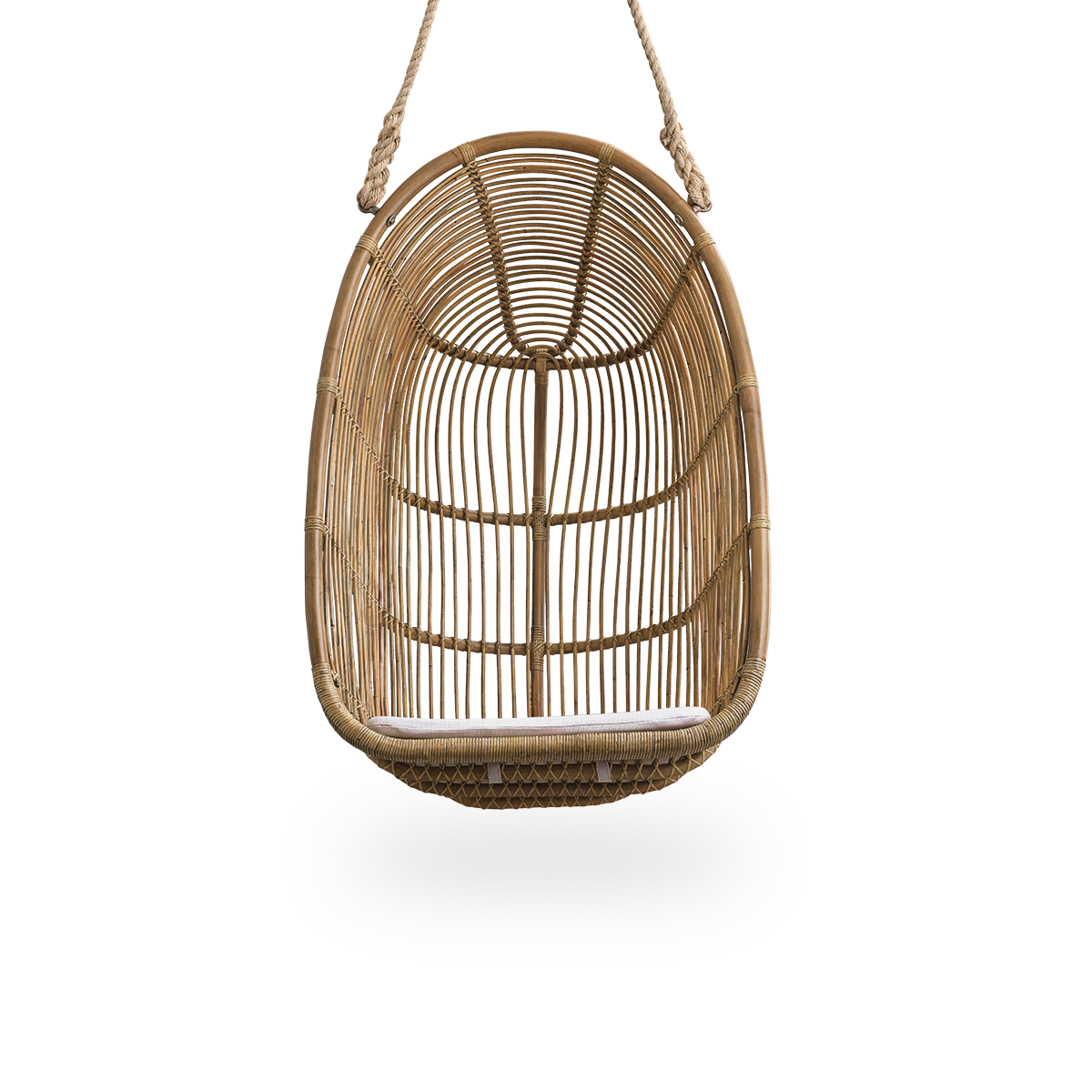 Front view of the Renoir hanging chair in antique brown color handcrafted in high-quality rattan.
Soft, embracing shape suspended with strong rope.