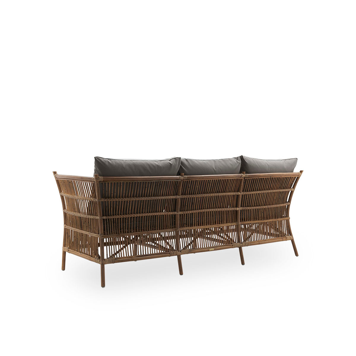 Plain back view of Donatello 3-seater wicker sofa in Antique brown color. The sofa has a boxy design with strict lines handcrafted from high-quality Indonesian rattan.