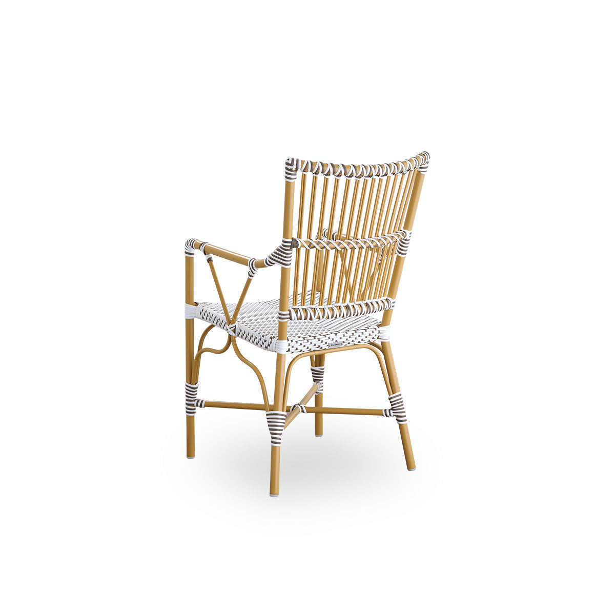 Back side view of the Monique outdoor dining armchair.
Aluminum frame in almond color with seat woven with ArtFibre in white with brown dots. Inspired by 1950s bistro design.