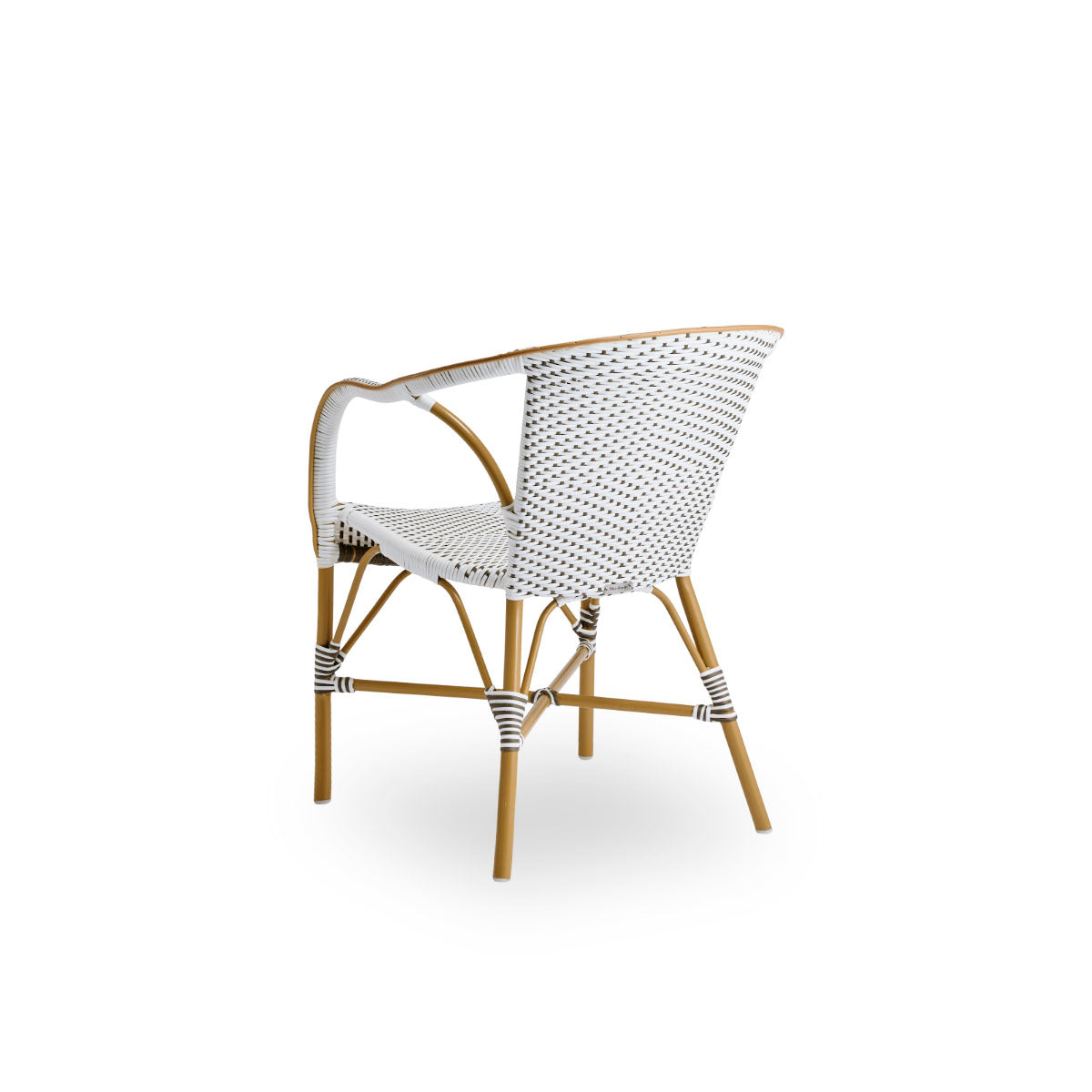 Back side view of the Madeleine outdoor dining armchair.
Aluminum frame in almond color with seat and backrest woven with ArtFibre in brown with white dots.