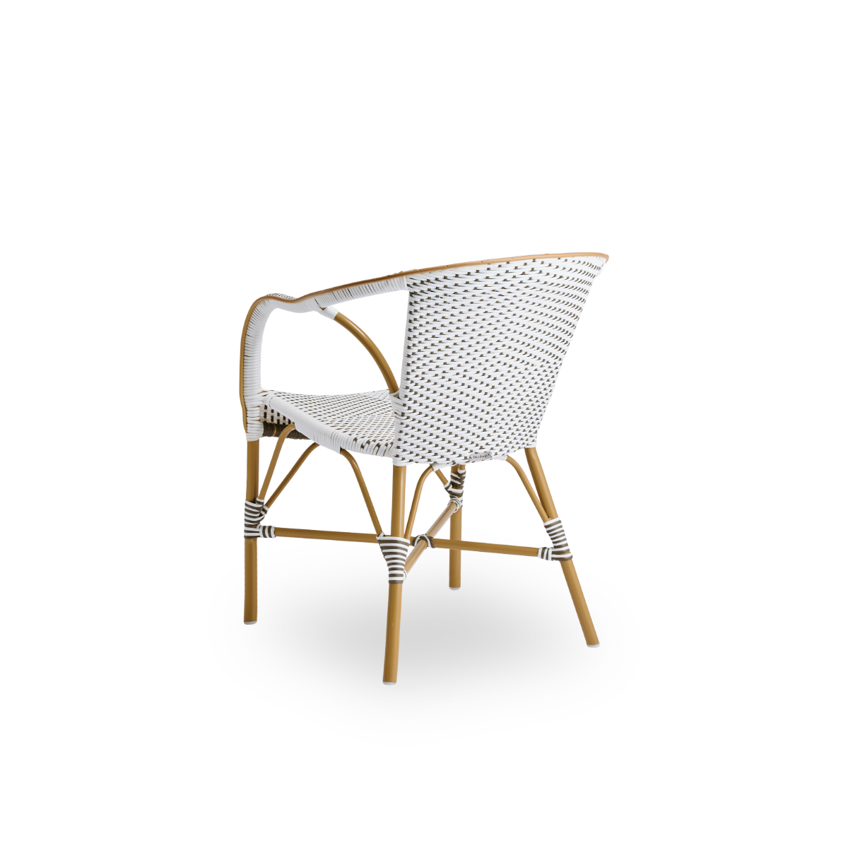 Back side view of the Madeleine outdoor dining armchair.
Aluminum frame in almond color with seat and backrest woven with ArtFibre in brown with white dots.
