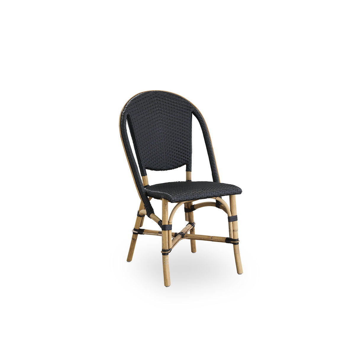 Side view of Sofie rattan dining chair inspired by French café style. Rattan frame with fully woven seat- and backrest handcrafted in ArtFibre in black color. Stackable rattan bistro chair.