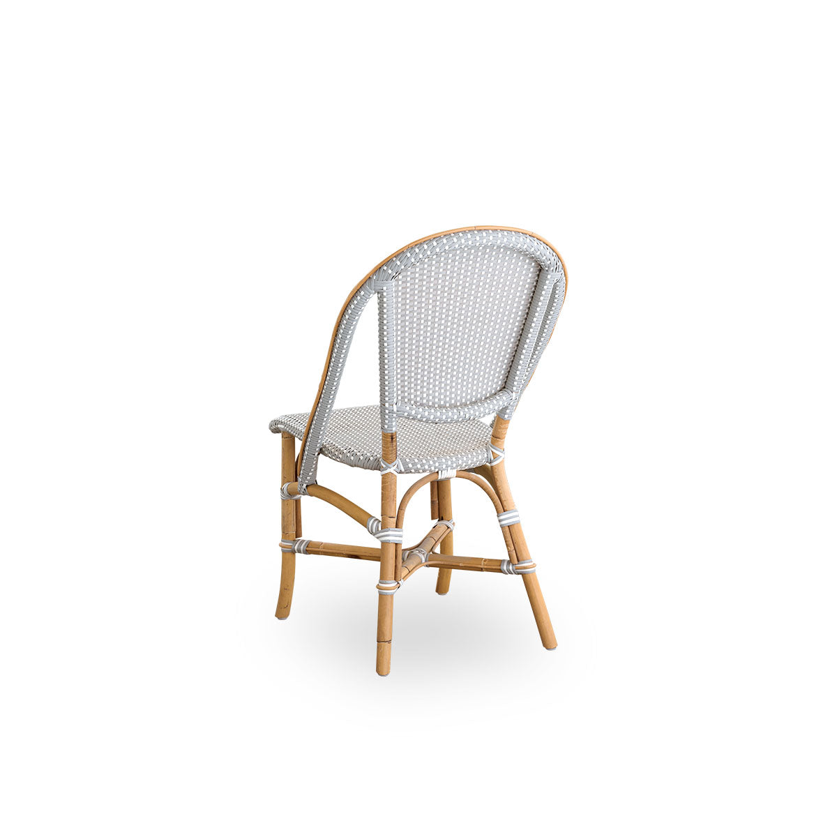 Back side view of the Sofie rattan dining chair inspired by French café style.
Rattan frame with fully woven seat and backrest handcrafted in ArtFibre in grey with white dots pattern. Stackable rattan bistro chair.