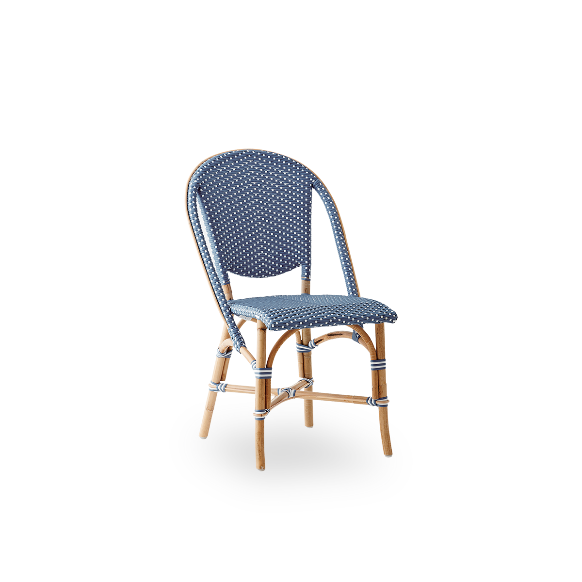 Side view of Sofie rattan dining chair inspired by French café style. Rattan frame with fully woven seat- and backrest handcrafted in ArtFibre in blue with white dots pattern. Stackable rattan bistro chair.