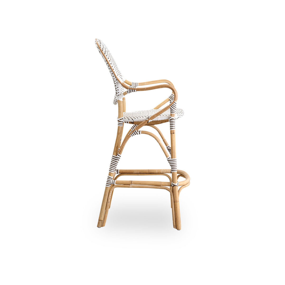 Plain side view of Isabell barstool with high bagrest, armrests and footrest. Natural rattan frame with ArtFibre seat in white with cappuccino dots. Inspired by 1950s bistro design.