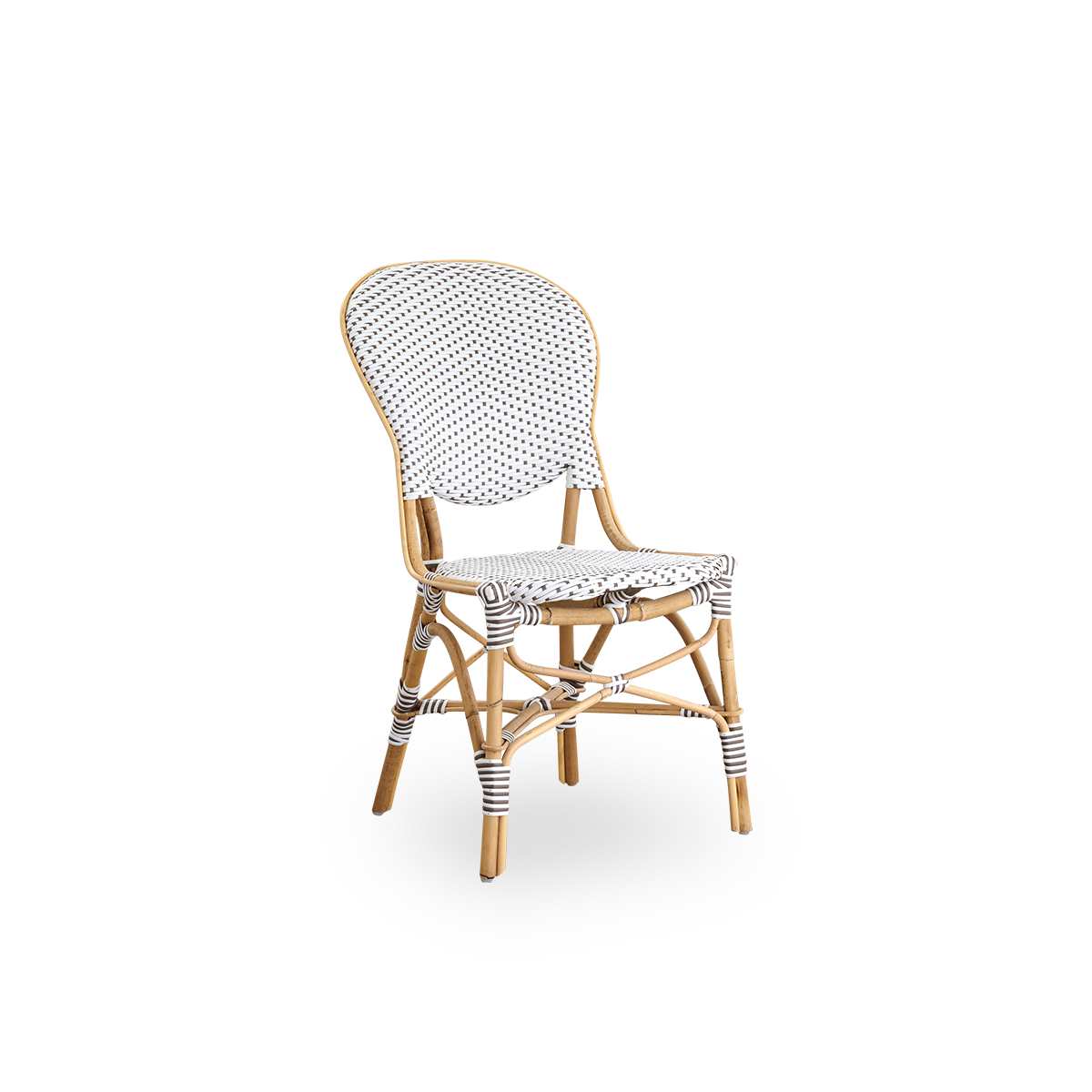 Side view of Isabell dining chair. Rattan frame with seat and backrest made in white ArtFibre with brown dots. Inspired by 1950s bistro design.