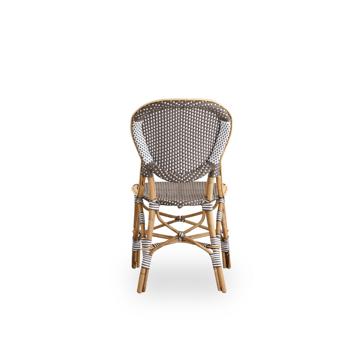 Plain back view of Isabell dining chair. Rattan frame with seat and backrest made in brown ArtFibre with white dots. Inspired by 1950s bistro design.