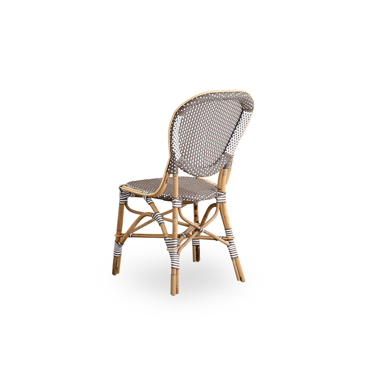 Back side view of the Isabell dining chair.
Rattan frame with seat and backrest made in brown ArtFibre with white dots. Inspired by 1950s bistro design.
