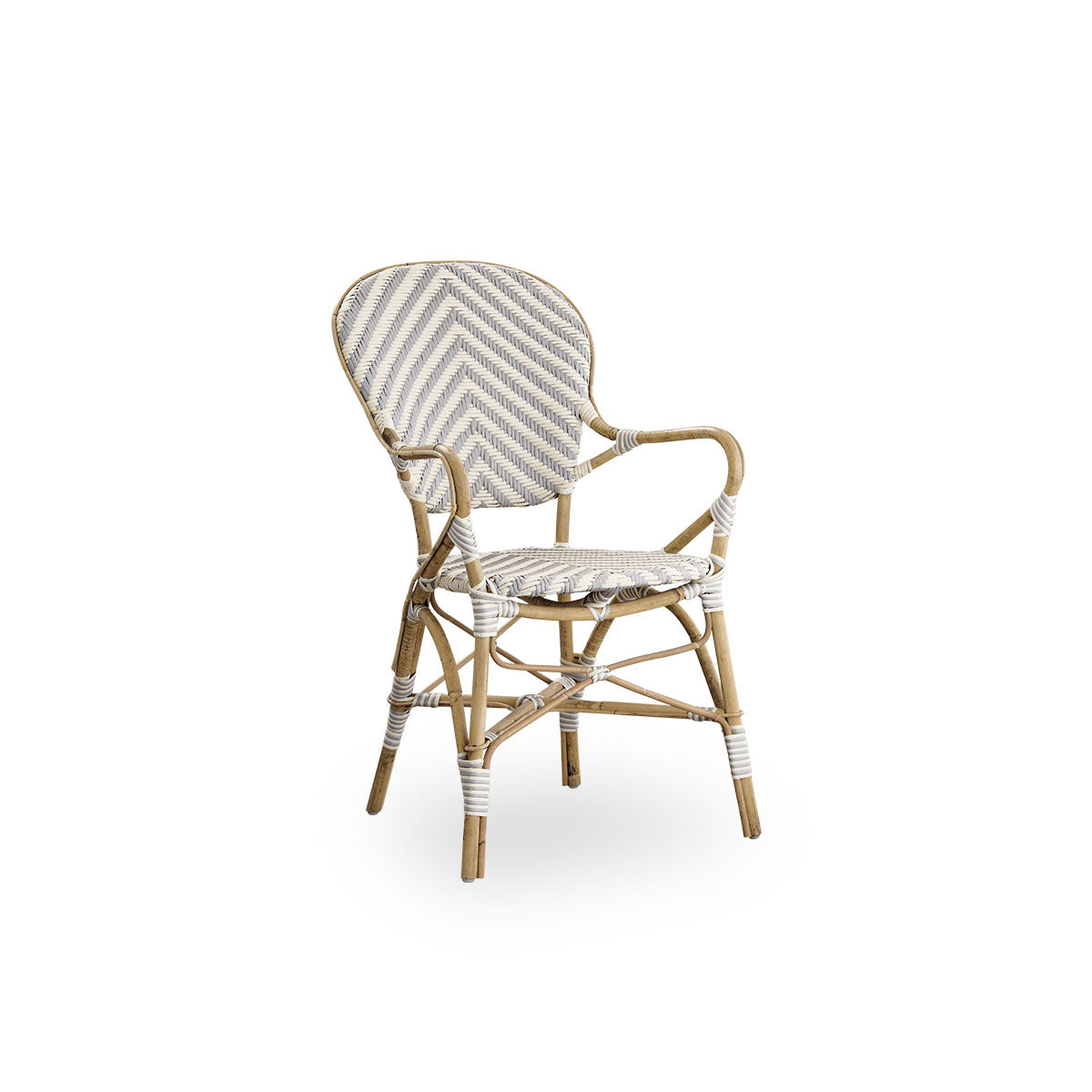 Side view of Isabell dining chair with armrest. Rattan frame with seat and backrest made in ArtFibre in ivory and grey herringbone pattern. Inspired by 1950s bistro design.