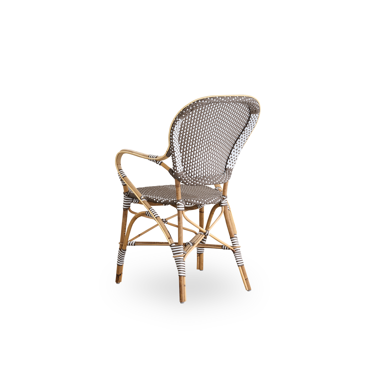 Back side view of the Isabell dining chair with armrests.
Rattan frame with seat and backrest made in brown ArtFibre with white dots. Inspired by 1950s bistro design.