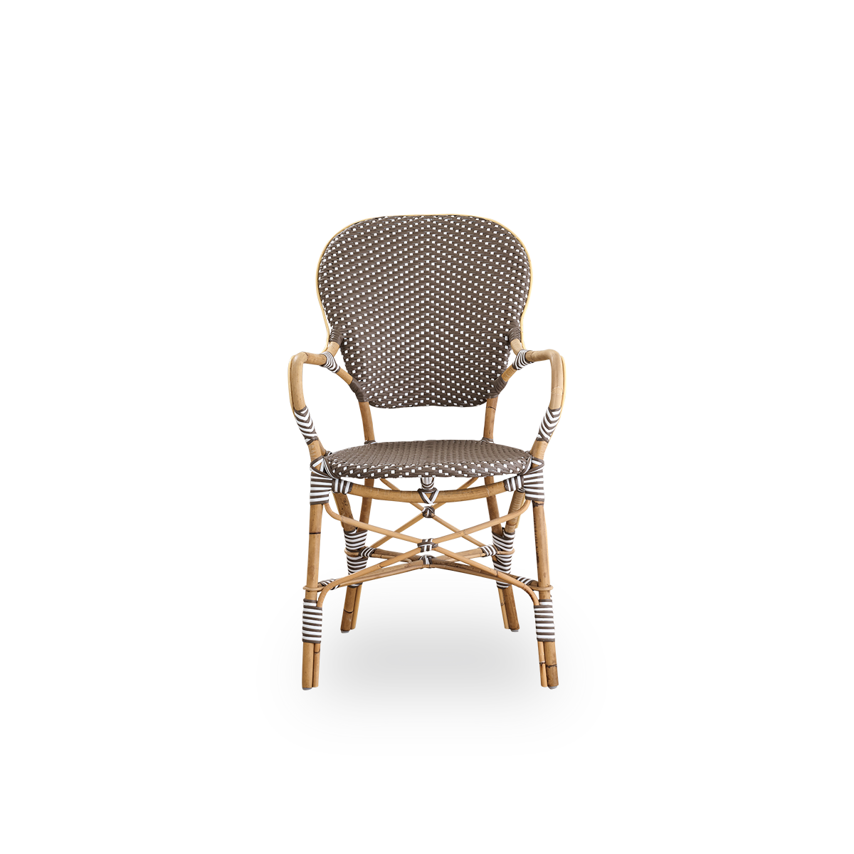 Front view of the Isabell dining chair with armrests.
Rattan frame with seat and backrest made in brown ArtFibre with white dots. Inspired by 1950s bistro design.