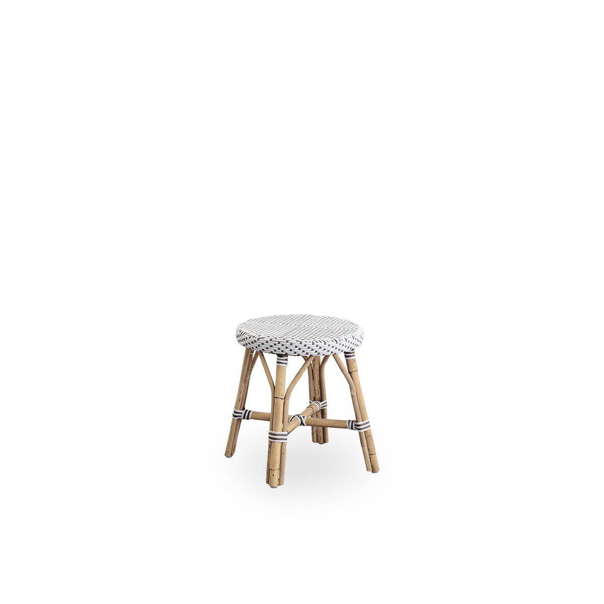 Side view of Simone stool height 52 cm. Rattan frame with footrest, with fully woven round seat handcrafted in ArtFibre in white with brown dots pattern. Stackable rattan stool.