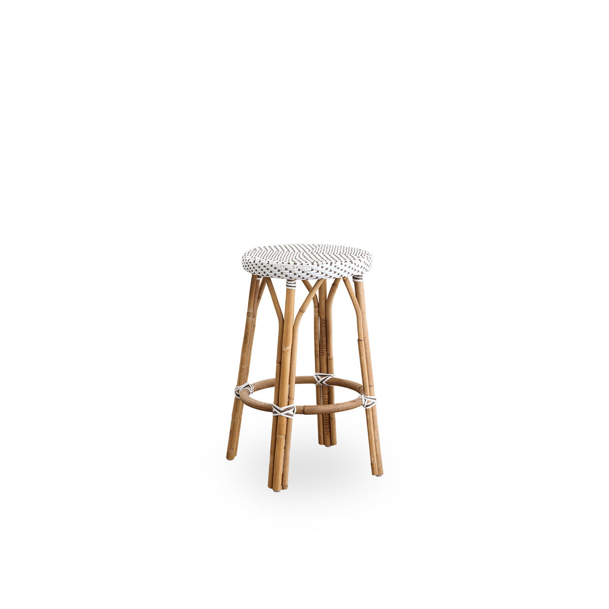 Side view of Simone counterstool height 68 cm. Rattan frame with footrest, with fully woven round seat handcrafted in ArtFibre in white with brown dots pattern. Stackable counterstool.