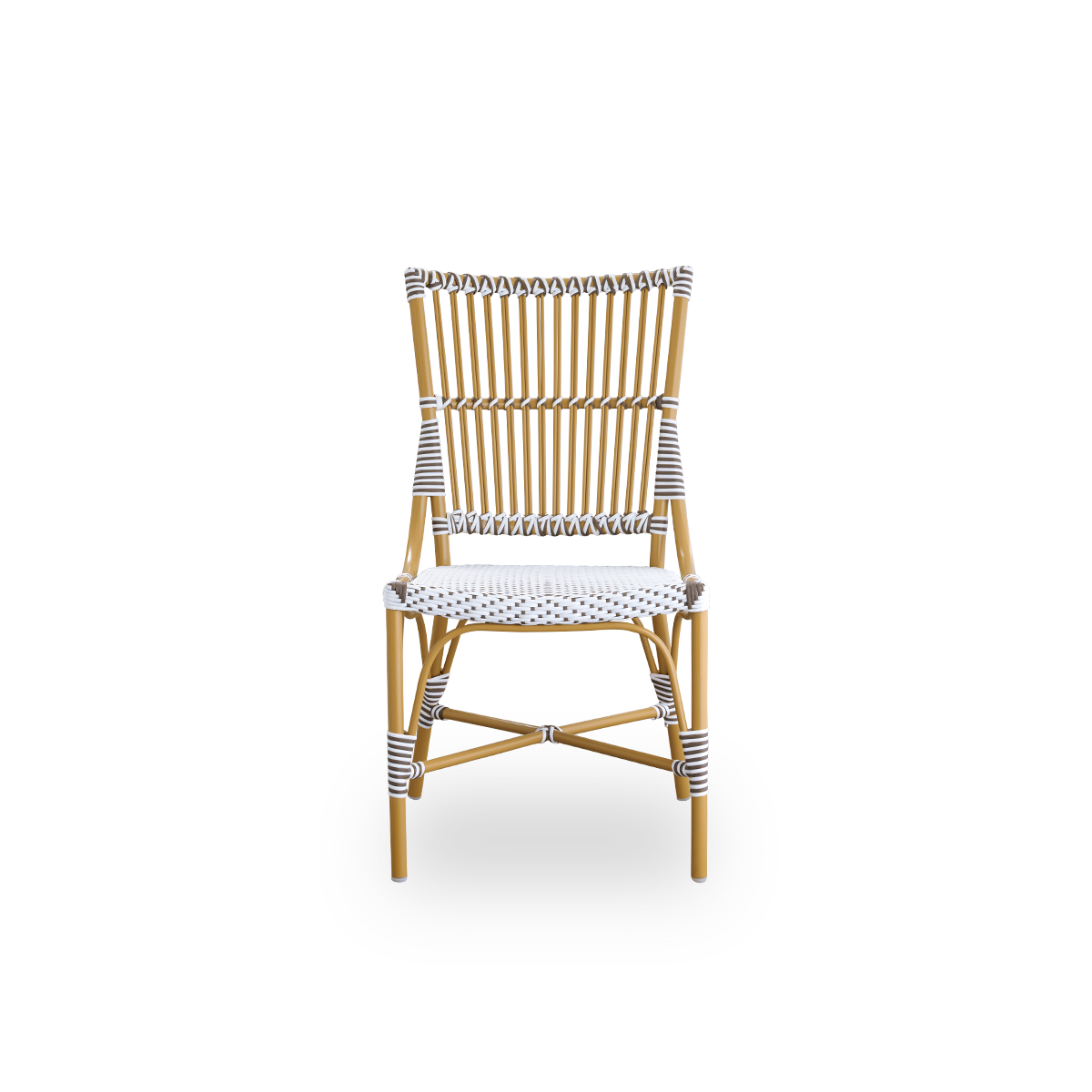 Front view of the Monique dining chair.
Rattan frame with seat woven with ArtFibre in white with brown dots. Inspired by 1950s bistro design.