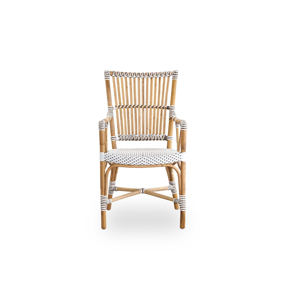 Front view of the Monique dining armchair.
Rattan frame with seat woven with ArtFibre in white with brown dots. Inspired by 1950s bistro design.