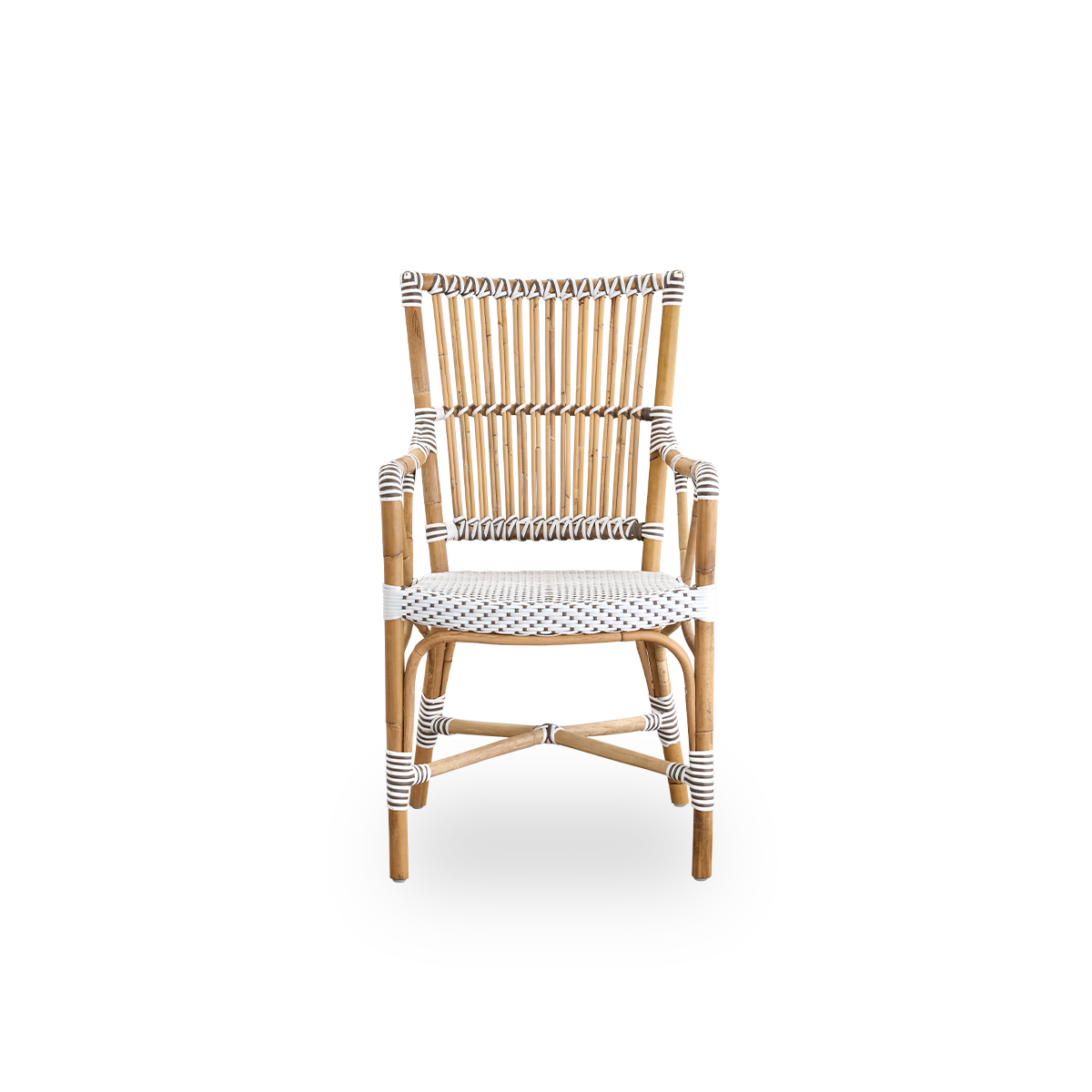 Front view of the Monique dining armchair.
Rattan frame with seat woven with ArtFibre in white with brown dots. Inspired by 1950s bistro design.