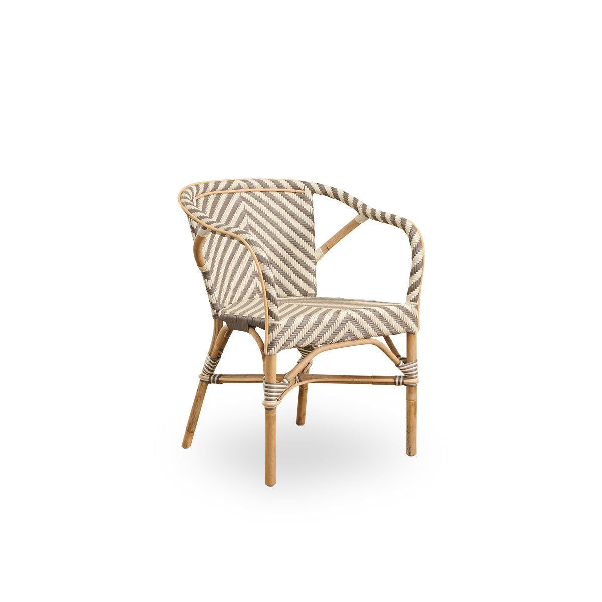 Side view of Madeleine dining armchair. Rattan frame with seat and backrest woven with ArtFibre in ivory and brown herringbone pattern. Inspired by 1950s bistro design.