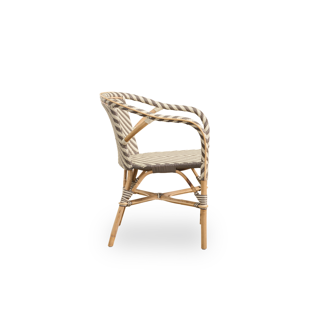 Plain side view of Madeleine dining armchair. Rattan frame with seat and backrest woven with ArtFibre in ivory and brown herringbone pattern. Inspired by 1950s bistro design.