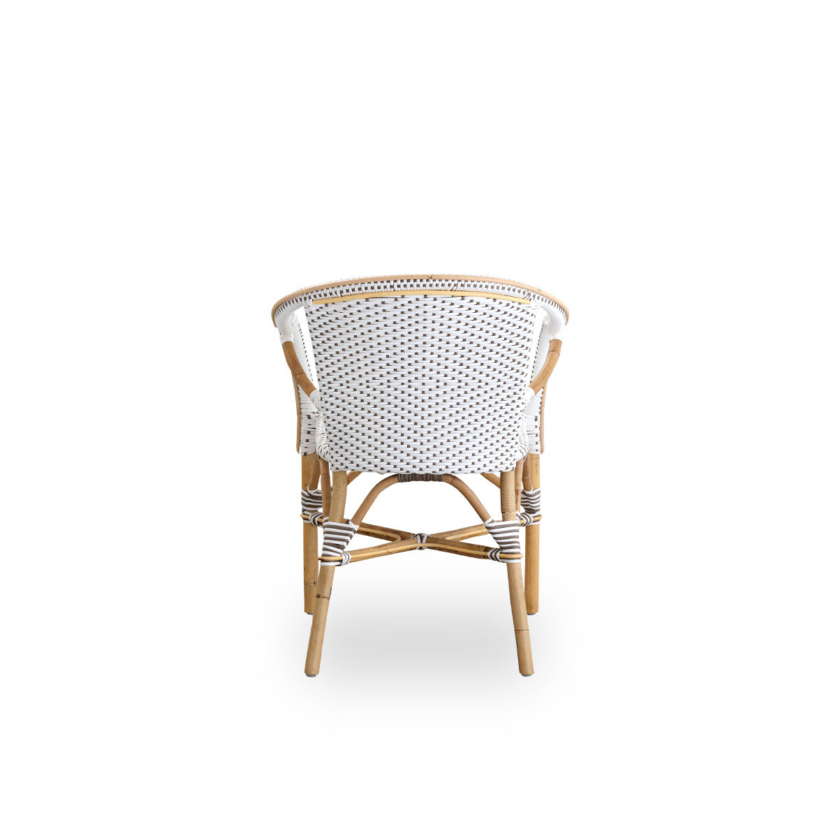Plain back view of Madeleine dining armchair. Rattan frame with seat and backrest woven with ArtFibre in white with brown dots. Inspired by 1950s bistro design.