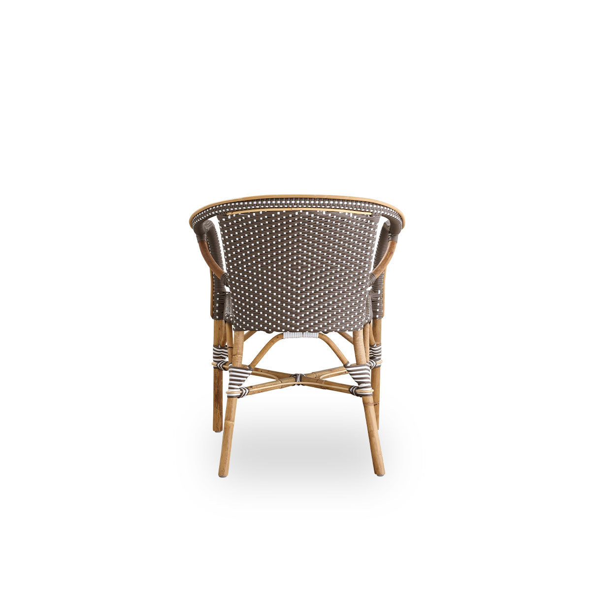 Plain back view of Madeleine dining armchair. Rattan frame with seat and backrest woven with ArtFibre in brown with white dots. Inspired by 1950s bistro design.