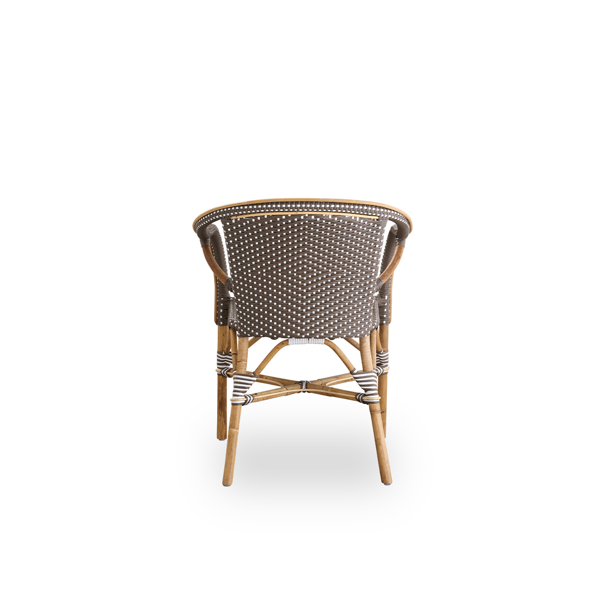 Plain back view of Madeleine dining armchair. Rattan frame with seat and backrest woven with ArtFibre in brown with white dots. Inspired by 1950s bistro design.