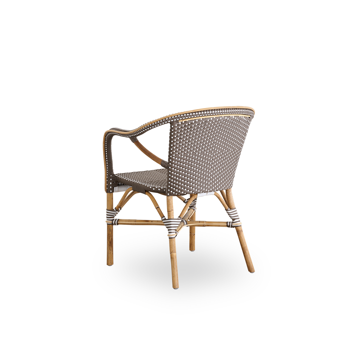 Back side view of the Madeleine dining armchair.
Rattan frame with seat and backrest woven with ArtFibre in brown with white dots. Inspired by 1950s bistro design.