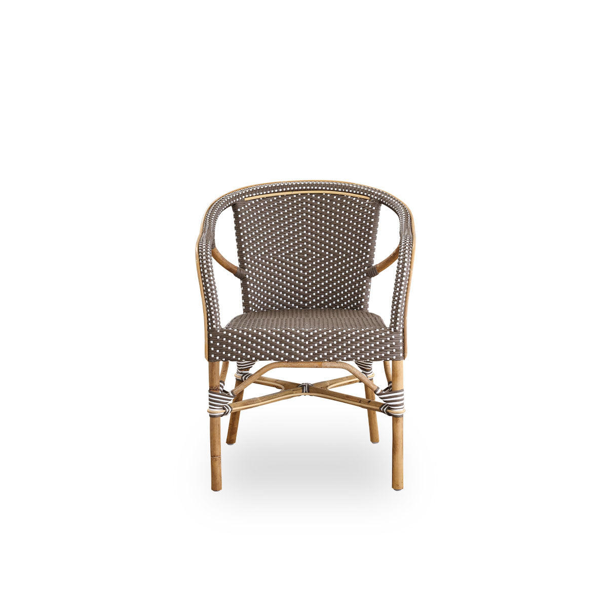 Front view of the Madeleine dining armchair.
Rattan frame with seat and backrest woven with ArtFibre in brown with white dots. Inspired by 1950s bistro design.