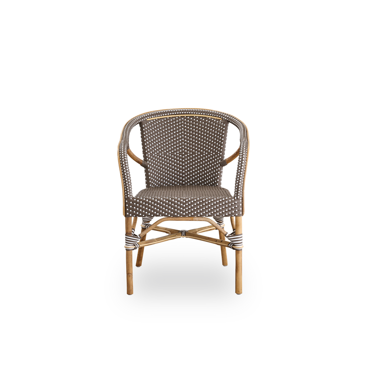Front view of the Madeleine dining armchair.
Rattan frame with seat and backrest woven with ArtFibre in brown with white dots. Inspired by 1950s bistro design.