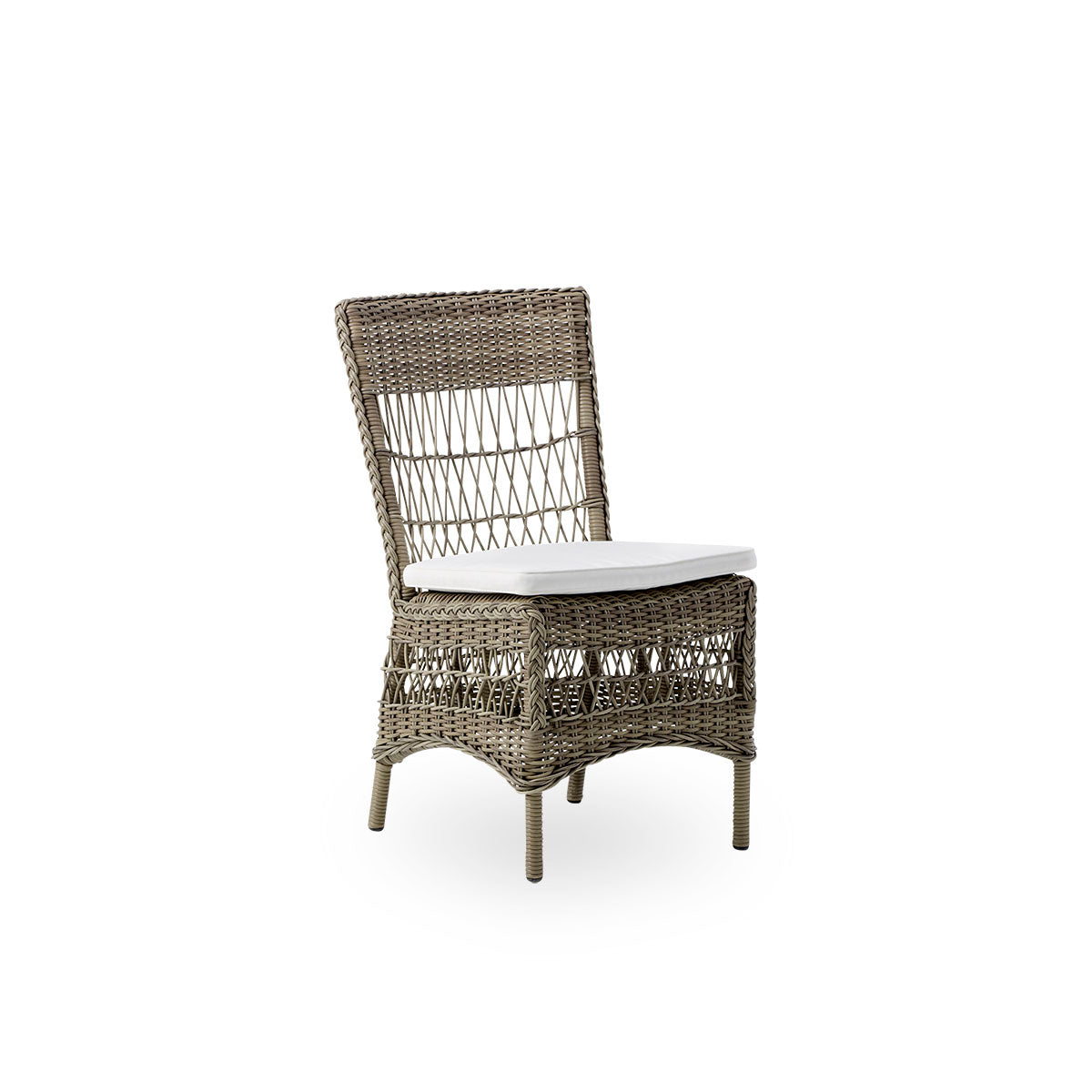Side view of Marie outdoor dining chair presented in Antique grey color. Aluminum frame fully woven with ArtFibre inspired by British colonial style.