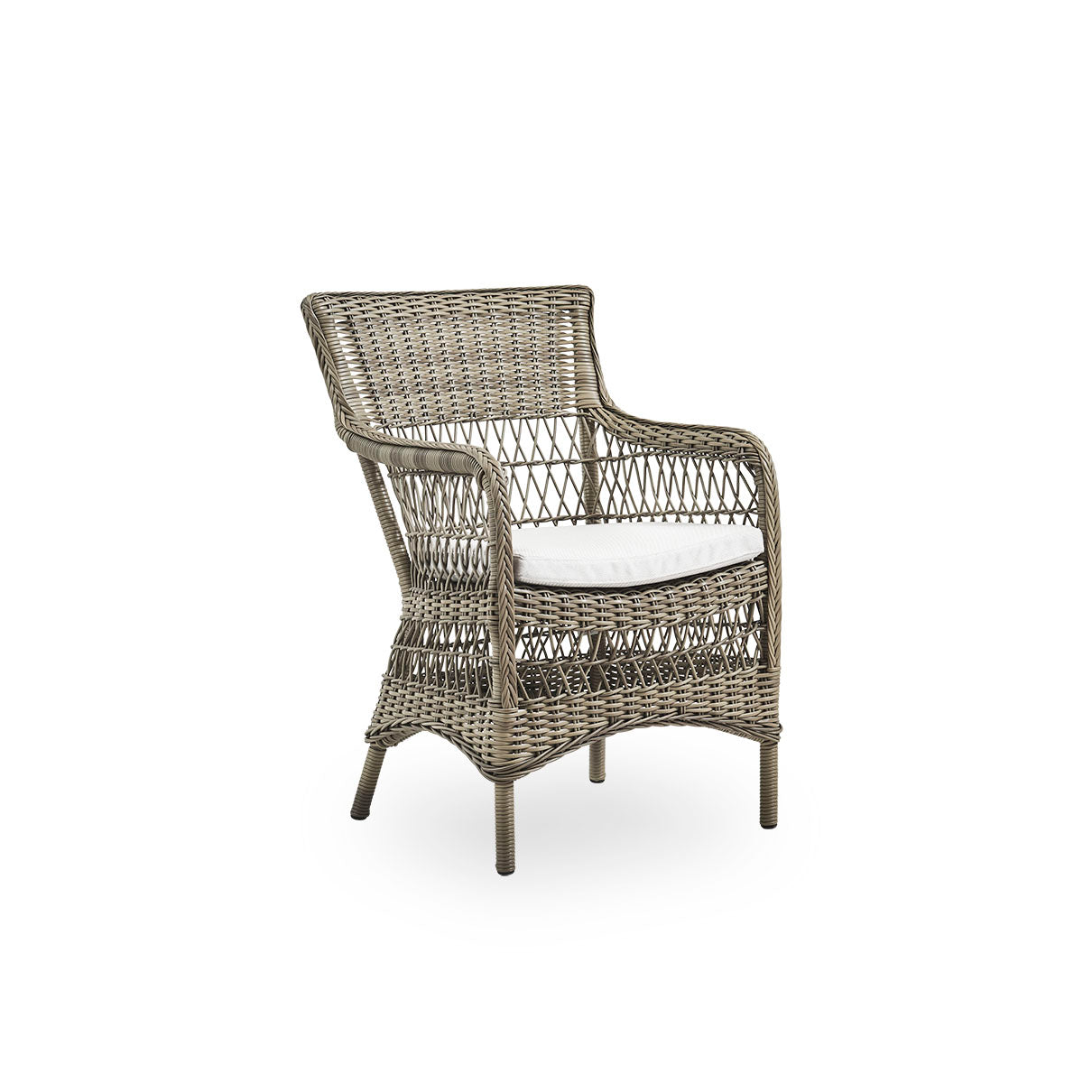 Side view of Marie outdoor dining chair with armrests presented in Antique grey color. Aluminum frame fully woven with ArtFibre inspired by British colonial style.