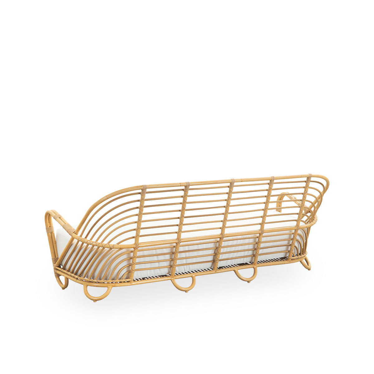 Back side view of the Charlottenborg Exterior 3-seater sofa in rattan look, designed by Arne Jacobsen. The sofa features a curved back and armrests integrated into the base, handcrafted with an Alu-Rattan frame and woven ArtFibre details.