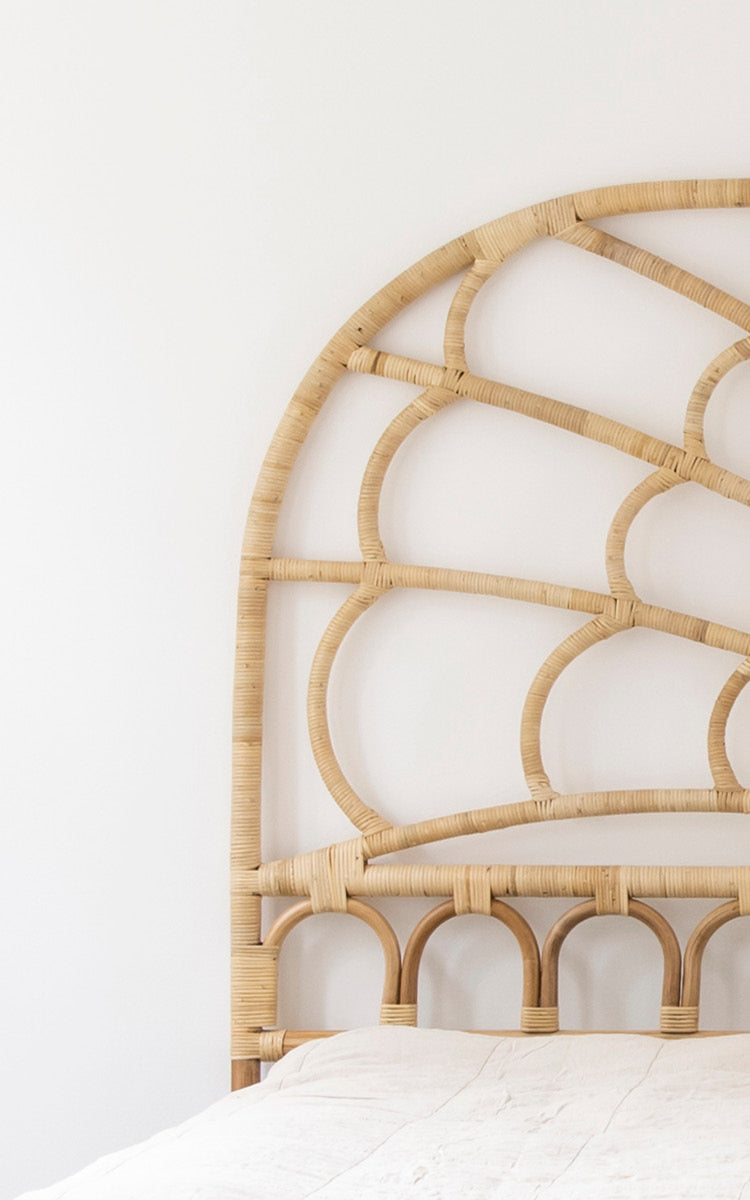 This is a close-up image of Celia Headboard in natural rattan.
