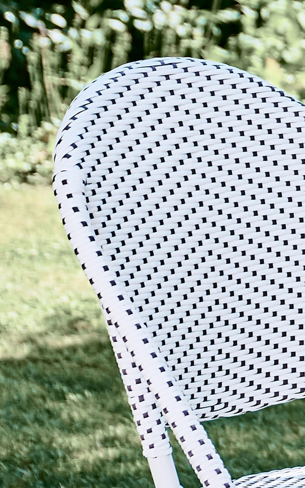 This is a close-up image of Sofie Exterior Dining Chair in white aluminium frame white w cappuccino dot artfibre.