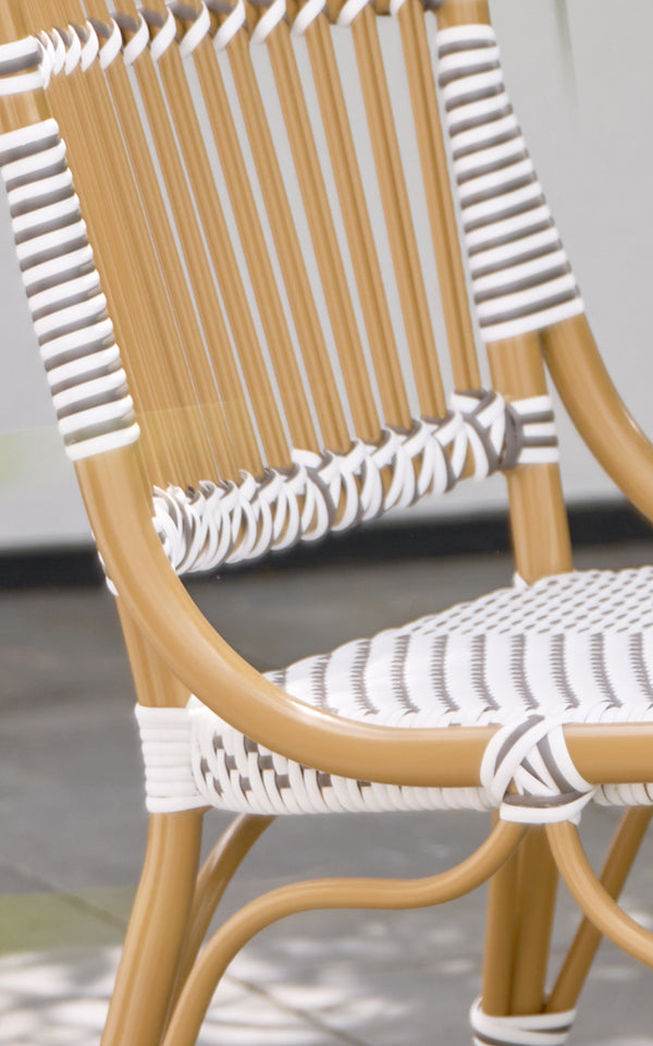 This is a close-up image of Monique Exterior Dining Chair in white w cappuccino dot ArtFibre. Detail of the striped weave pattern.