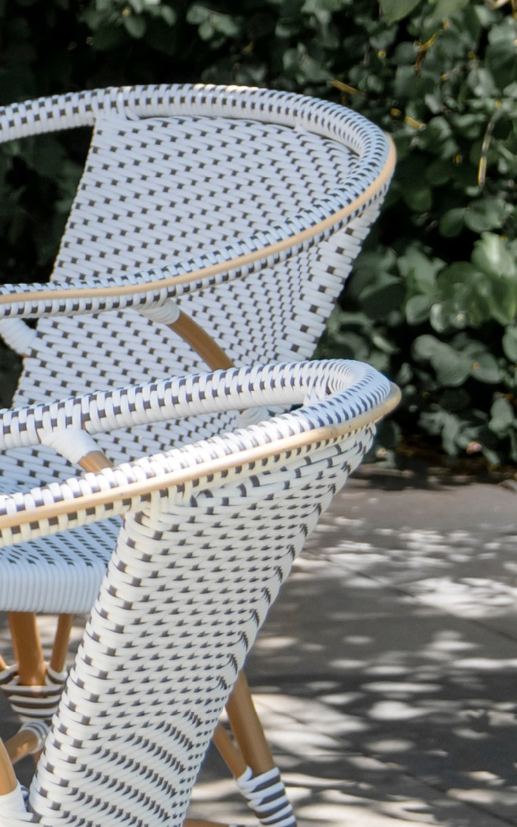 This is a close-up image of Madeleine Exterior Dining Chair in almond aluminium frame white w cappuccino dot ArtFibre. Dot weave pattern detail.