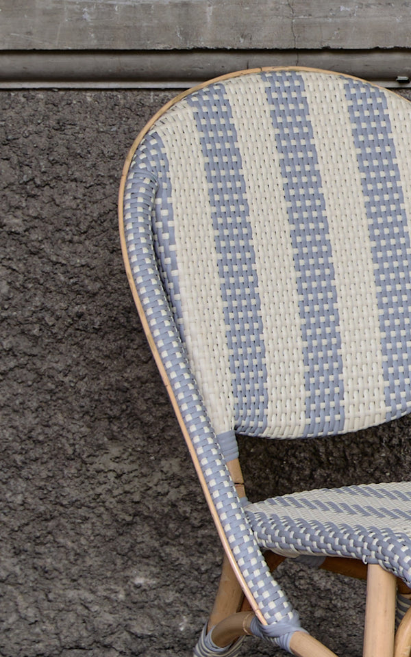 This is a close-up image of Sofie Dining Chair in striped grey ivory artfibre skin on rattan frame.