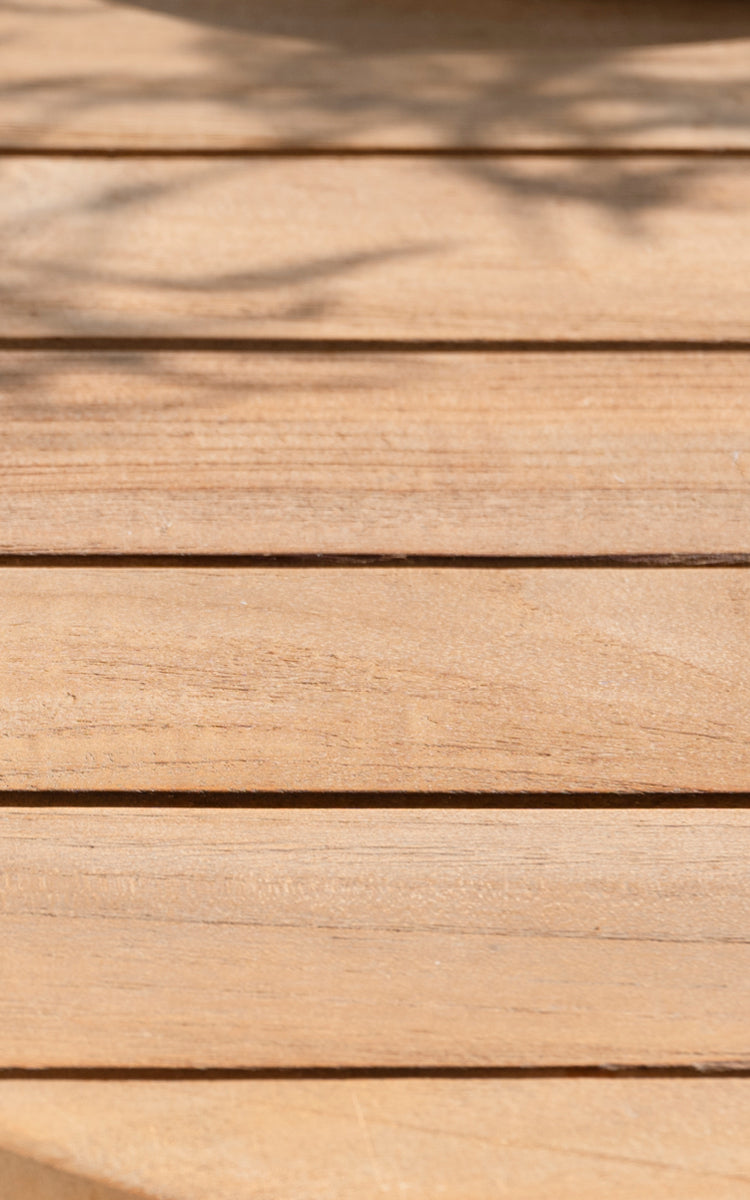 This is a close-up image of George Exterior Table 240 in outdoor Teak.