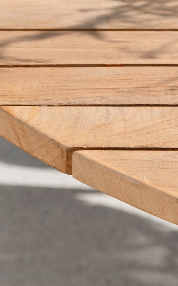 This is a close-up image of George Exterior Table Ø160 in outdoor Teak.