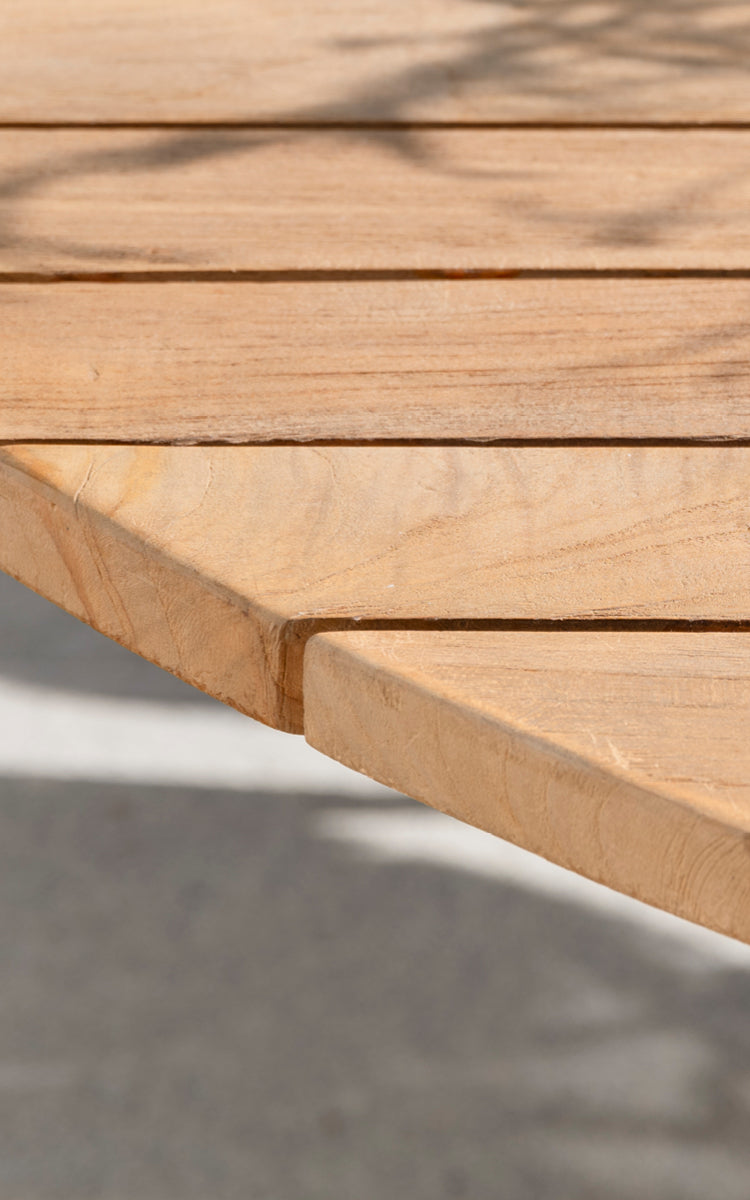 This is a close-up image of George Exterior Table Ø160 in outdoor Teak.