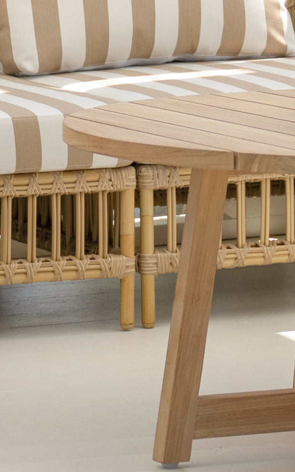 This is a close-up image of Victor Teak Lounge Table Ø120 cm in teak outdoor. Detail of the woven texture and frame construction.